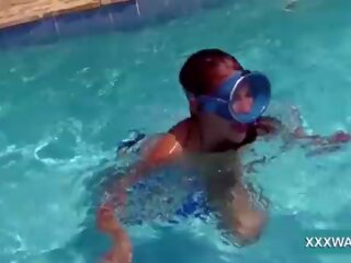 Sensational brunette call girl Candy swims underwater